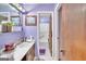 Bright bathroom featuring classic fixtures, tile flooring, and natural light at 9100 Settlers Grove Ne Rd, Covington, GA 30014