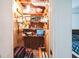 Bedroom closet with open wooden shelving, hanging clothes and storage boxes, suitcases and more at 9100 Settlers Grove Ne Rd, Covington, GA 30014