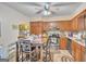 Functional kitchen space with ample cabinetry, stainless steel appliances, and tiled floor at 9100 Settlers Grove Ne Rd, Covington, GA 30014