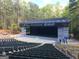 Outdoor amphitheater featuring rows of seats surrounded by mature trees at 310 Westbourne Dr, Tyrone, GA 30290