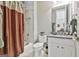 Bathroom featuring a shower-tub combination with curtain and a white vanity at 310 Westbourne Dr, Tyrone, GA 30290