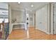 Well-lit foyer with hardwood floors, white walls, and an elegant console table at 310 Westbourne Dr, Tyrone, GA 30290