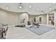 Basement gym with modern exercise equipment, a comfortable couch, and a mirrored wall at 310 Westbourne Dr, Tyrone, GA 30290