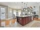 Well-appointed kitchen boasting a spacious island, stainless steel appliances, and a cozy breakfast nook area at 310 Westbourne Dr, Tyrone, GA 30290