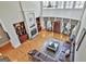 High-ceiling living room featuring a fireplace, hardwood floors, and natural light at 310 Westbourne Dr, Tyrone, GA 30290