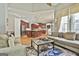 Spacious living room featuring hardwood floors and kitchen island with barstool seating at 310 Westbourne Dr, Tyrone, GA 30290