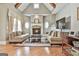 Spacious living room with vaulted ceiling, stone fireplace, and plush seating, creating a cozy atmosphere at 310 Westbourne Dr, Tyrone, GA 30290