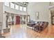 Spacious living room featuring high ceilings, a wall of windows and a stone fireplace at 310 Westbourne Dr, Tyrone, GA 30290