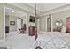 Large main bedroom leading to an office, featuring a four-poster bed and tasteful decor, offering comfort at 310 Westbourne Dr, Tyrone, GA 30290