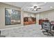 This wine cellar features custom wood wine racks, tile floors, decorative art, and a seating area at 310 Westbourne Dr, Tyrone, GA 30290