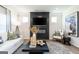 Comfortable living room with modern fireplace, plush seating, and stylish decor for relaxing at 10453 Trellis Lane (Lot 28), Hampton, GA 30228