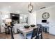 Open concept living room with dining area and fireplace at 10453 Trellis Lane (Lot 28), Hampton, GA 30228