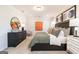Stately main bedroom exhibits neutral tones, ample natural light, and an inviting, comfortable space at 10453 Trellis Lane (Lot 28), Hampton, GA 30228