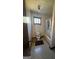 Bathroom featuring a toilet, shower with curtain, window and tile floor at 120 Wayside Dr, Lawrenceville, GA 30046