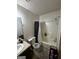 Standard bathroom featuring a shower-tub combo and single sink vanity at 120 Wayside Dr, Lawrenceville, GA 30046