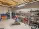 Unfinished basement features storage shelves and concrete floor at 180 Collins Way, Locust Grove, GA 30248