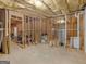 Spacious unfinished basement with exposed framing, ductwork, and concrete floor at 180 Collins Way, Locust Grove, GA 30248