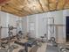 Spacious unfinished basement features exposed ceiling with gym equipment at 180 Collins Way, Locust Grove, GA 30248