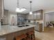 Charming kitchen featuring granite countertops, stainless steel appliances, and wood cabinets at 180 Collins Way, Locust Grove, GA 30248