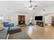 Cozy living room features a brick fireplace and large television at 180 Collins Way, Locust Grove, GA 30248