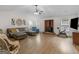 Comfortable living room with vaulted ceiling, fireplace, and a ceiling fan at 180 Collins Way, Locust Grove, GA 30248