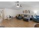 Spacious living room featuring a vaulted ceiling, fan, and comfortable furnishings at 180 Collins Way, Locust Grove, GA 30248