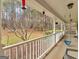 Inviting porch with a swing, offering a relaxing outdoor space at 180 Collins Way, Locust Grove, GA 30248