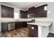 Modern kitchen with granite counters, stainless steel appliances, and wood cabinetry at 220 Long Dr, Mcdonough, GA 30253