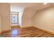 Bedroom with natural wood trim and wood-look floors at 5735 Archer Ave, Cumming, GA 30041