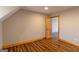 Bedroom with natural wood trim and wood-look floors at 5735 Archer Ave, Cumming, GA 30041