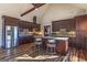 Modern kitchen island featuring sleek countertops and seating with stainless steel appliances at 5735 Archer Ave, Cumming, GA 30041