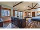 Bright kitchen and living space featuring hardwood floors and natural light at 5735 Archer Ave, Cumming, GA 30041