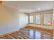 Cozy living room with wood floors and natural light at 5735 Archer Ave, Cumming, GA 30041