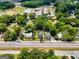 Aerial view showing the property, detailing its garden, nearby houses, and proximity to the road at 35 W Main St, Hampton, GA 30228
