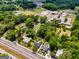 Property's location is highlighted in this aerial view, near a school and other neighborhood homes at 35 W Main St, Hampton, GA 30228