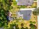 Aerial view of the property with a landscaped backyard, including fountain and gardens at 35 W Main St, Hampton, GA 30228
