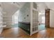 Attic space is separated by a whimsical partition wall and features wood floors and a brick chimney at 35 W Main St, Hampton, GA 30228
