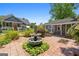 Charming backyard featuring a fountain and lush landscaping creating a serene and inviting outdoor space at 35 W Main St, Hampton, GA 30228