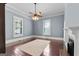 Spacious bedroom with wood floors, and a decorative fireplace at 35 W Main St, Hampton, GA 30228