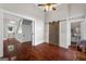 View into a light-filled room with hardwood floors, a closet with sliding doors and view to the entryway at 35 W Main St, Hampton, GA 30228