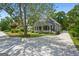 Charming two-story home with a welcoming front porch, large yard, and driveway at 35 W Main St, Hampton, GA 30228