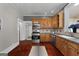 Classic kitchen with stainless steel appliances and dark countertops at 35 W Main St, Hampton, GA 30228