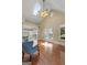 Sun-drenched living room boasting hardwood floors, vaulted ceiling, skylights, and ceiling fan at 35 W Main St, Hampton, GA 30228