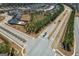 Neighborhood aerial showing homes, roads and trees. New construction development in an organized layout at 104 Conway St, Peachtree City, GA 30269