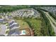 Aerial view of a community, showcasing homes with green spaces and landscaping at 104 Conway St, Peachtree City, GA 30269