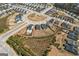 Aerial view of a residential area, showcasing homes with private pools and large yards at 104 Conway St, Peachtree City, GA 30269