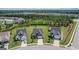 Neighborhood aerial view of single-Gathering homes, lush yards, and mature trees at 104 Conway St, Peachtree City, GA 30269