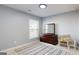 Bedroom features a large window, area rug and dresser at 104 Conway St, Peachtree City, GA 30269