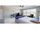 Bright bedroom features a tray ceiling with fan, workspace, sitting chair and large window with natural light at 104 Conway St, Peachtree City, GA 30269
