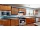 Modern kitchen design with stainless steel appliances and dark wood cabinets at 104 Conway St, Peachtree City, GA 30269